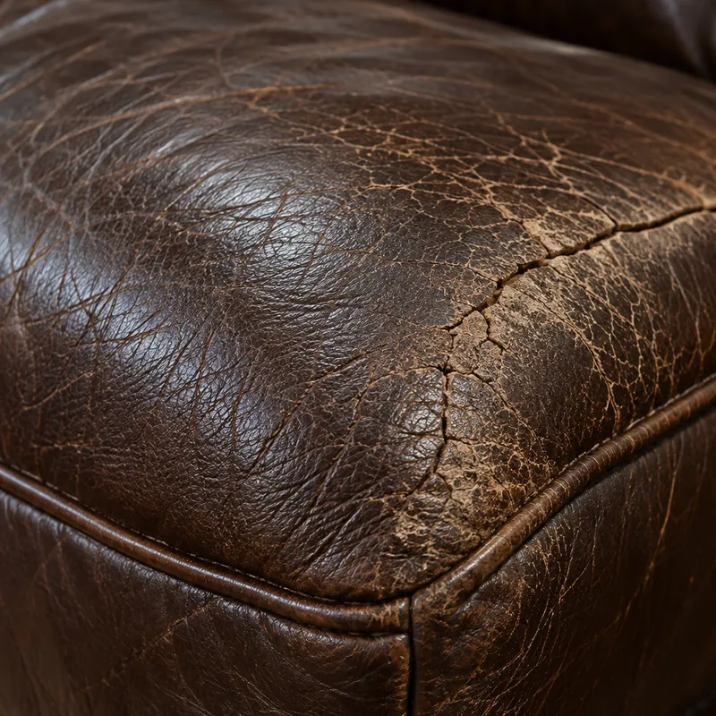 Fine age crazing spread evenly across an old brown leather cushion