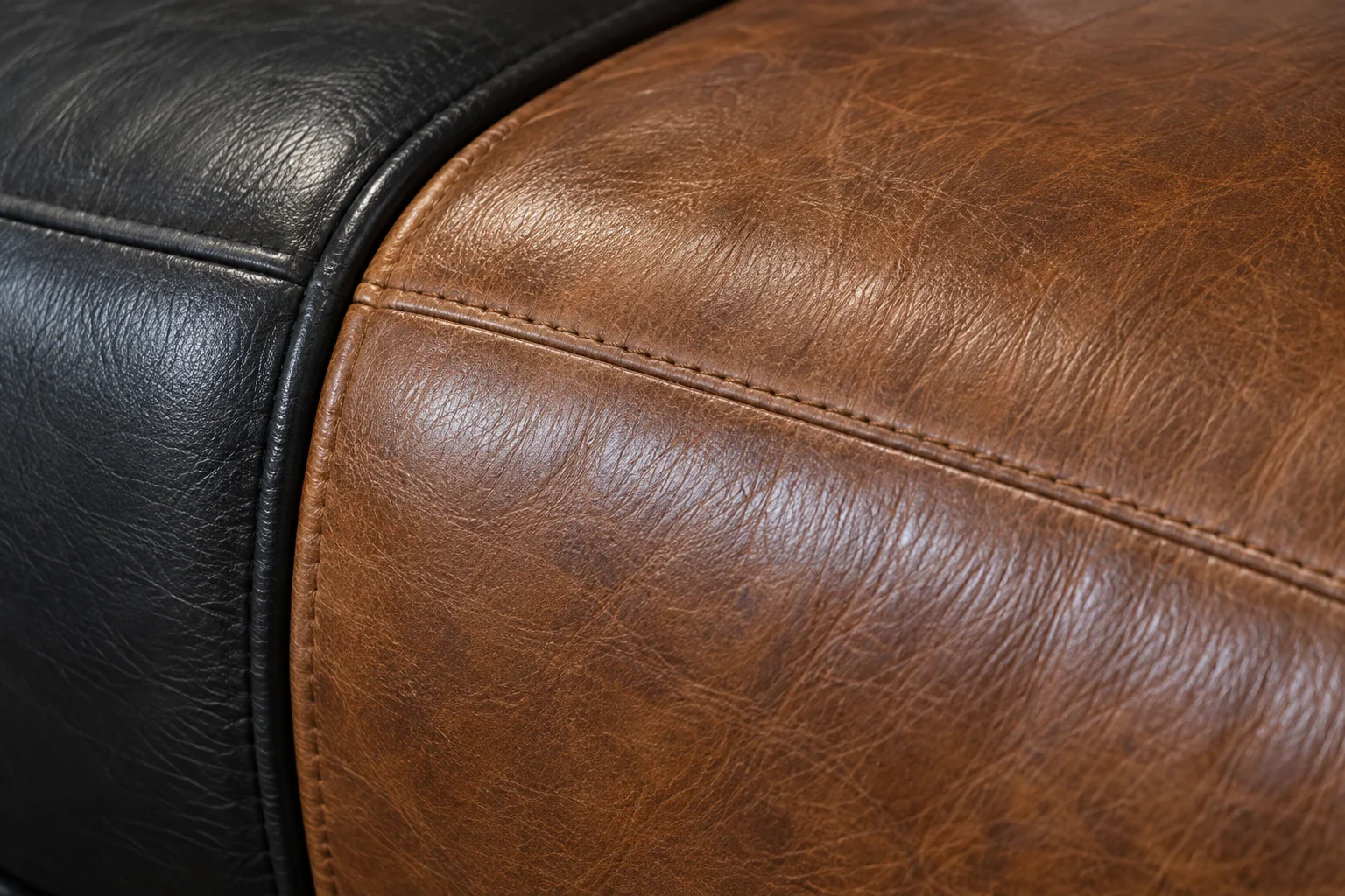 Black and tan leather panels meeting at a seam, showing a colour match