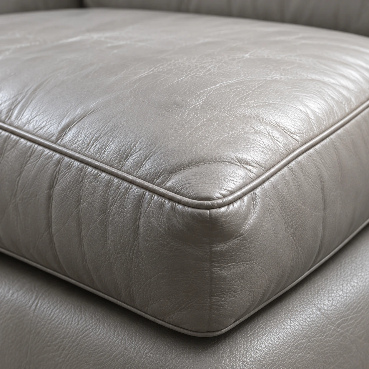 A pale grey seat cushion creased and collapsed at the front