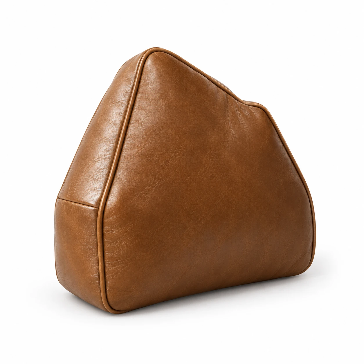 Tan leather cushion built to a one-off template with a curved back edge