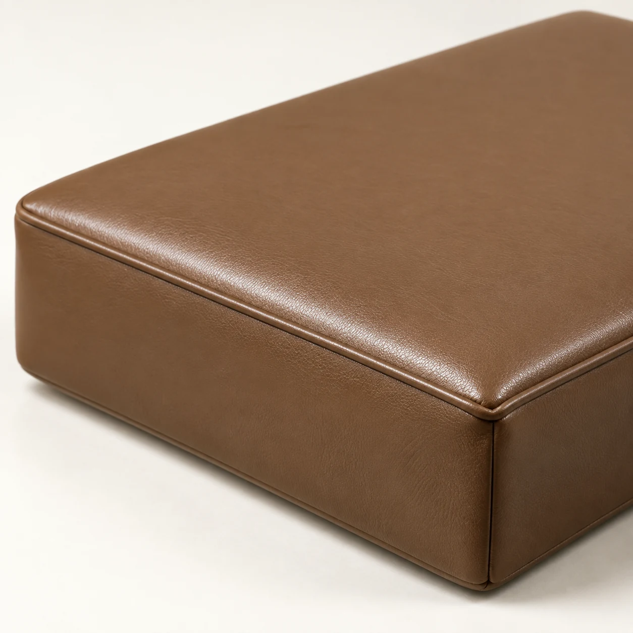 Fully fabricated brown leather seat cushion