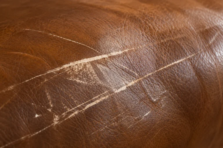 Through the color scratch on leather