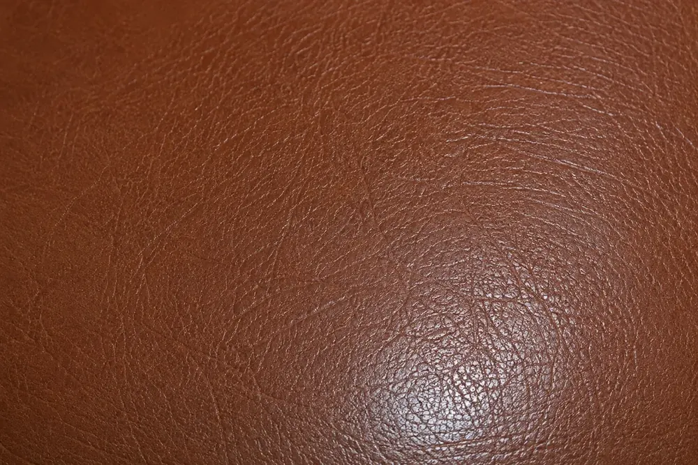 Macro of pebbled leather grain, the texture a repaired area has to be rebuilt to carry