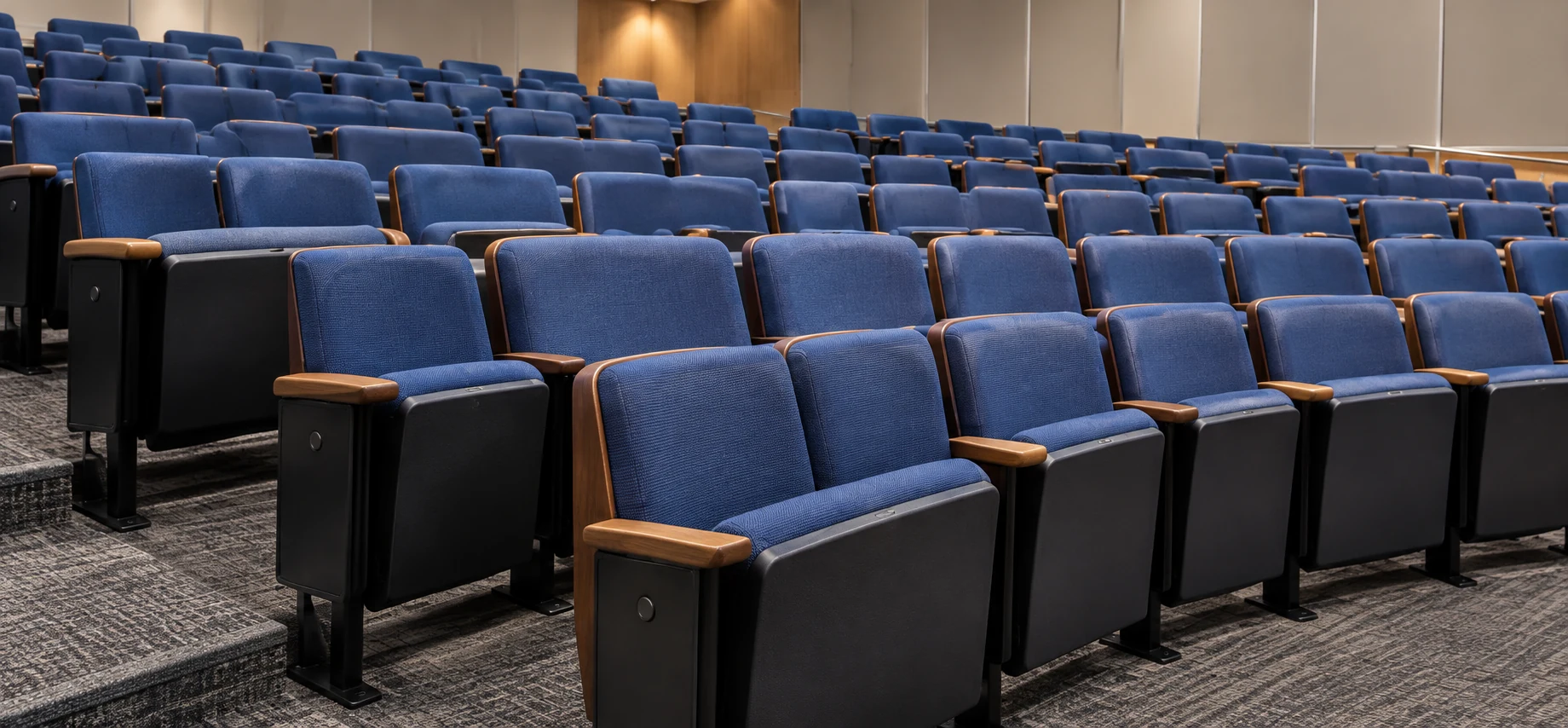 Tiered lecture hall seating with folding tablet arms