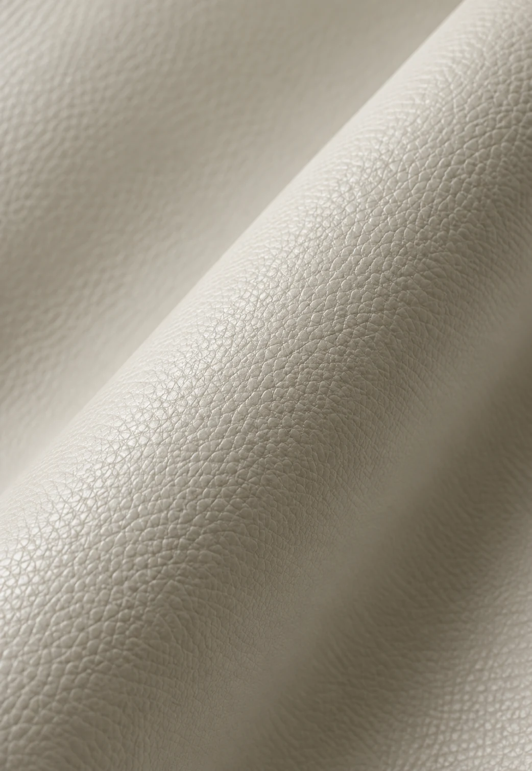 Roll of cream marine-grade vinyl with a pebble grain