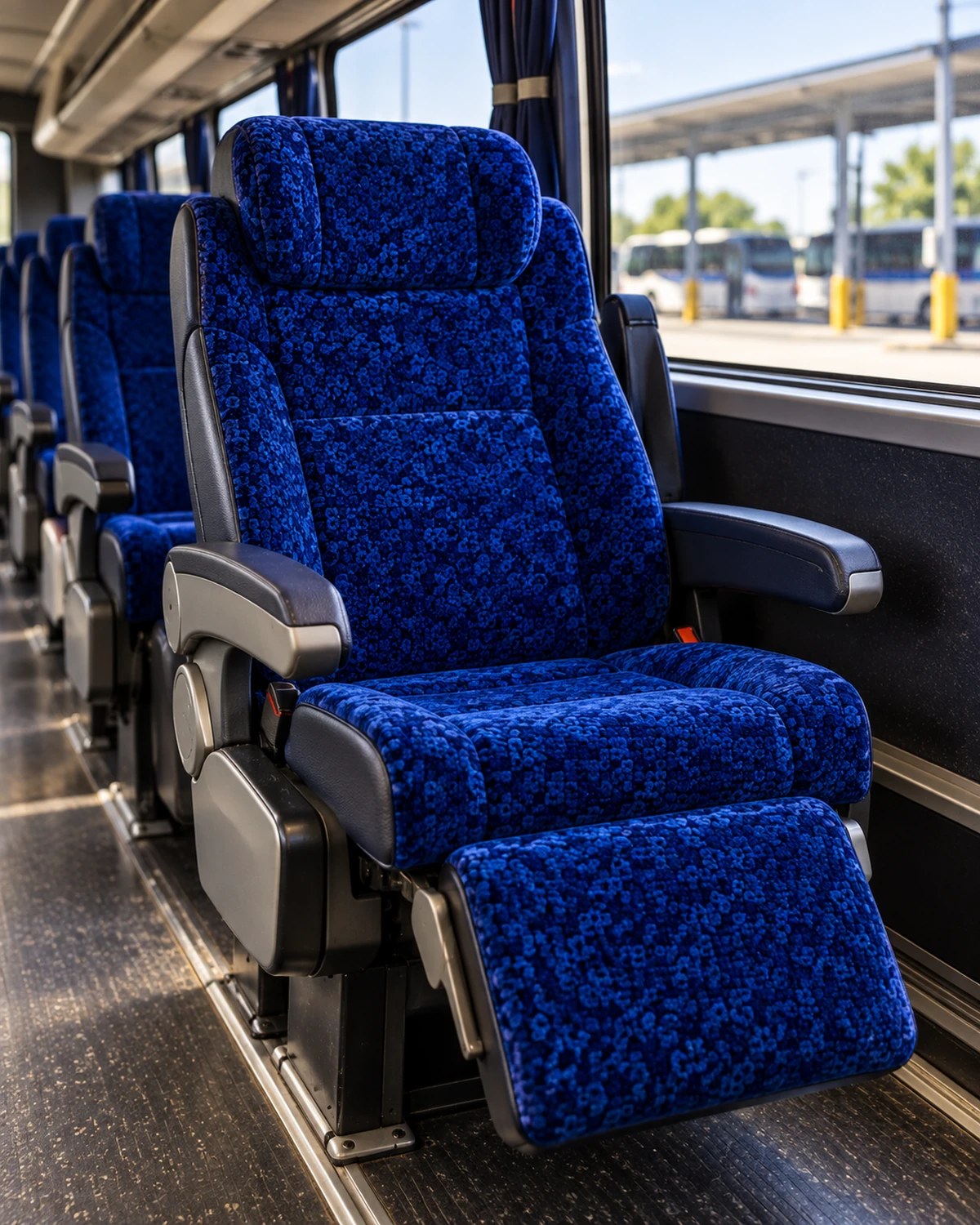 A reclining motorcoach seat with headrest and armrests
