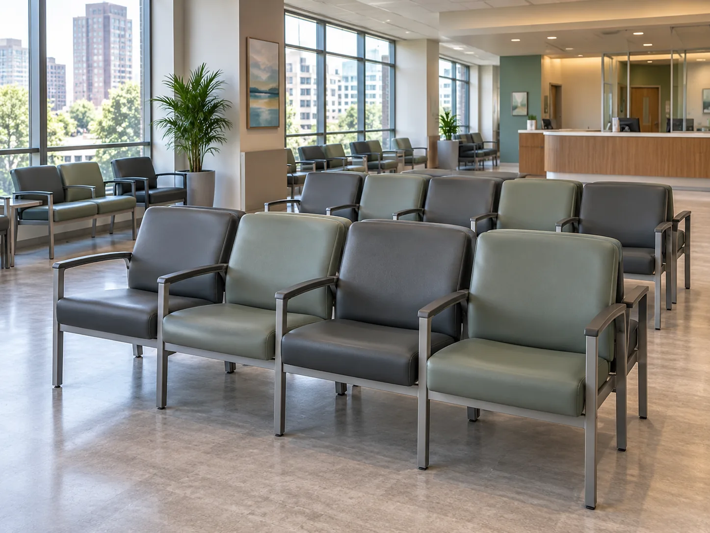 A large healthcare waiting area with rows of charcoal and sage chairs