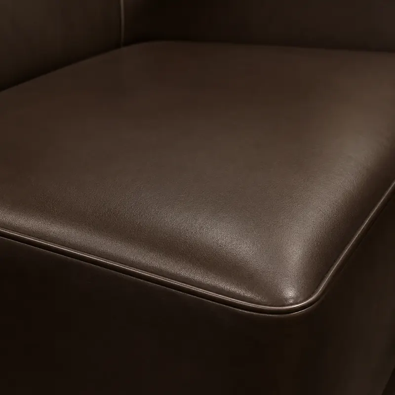 Contrast piping along the edge of an upholstered nightclub seat