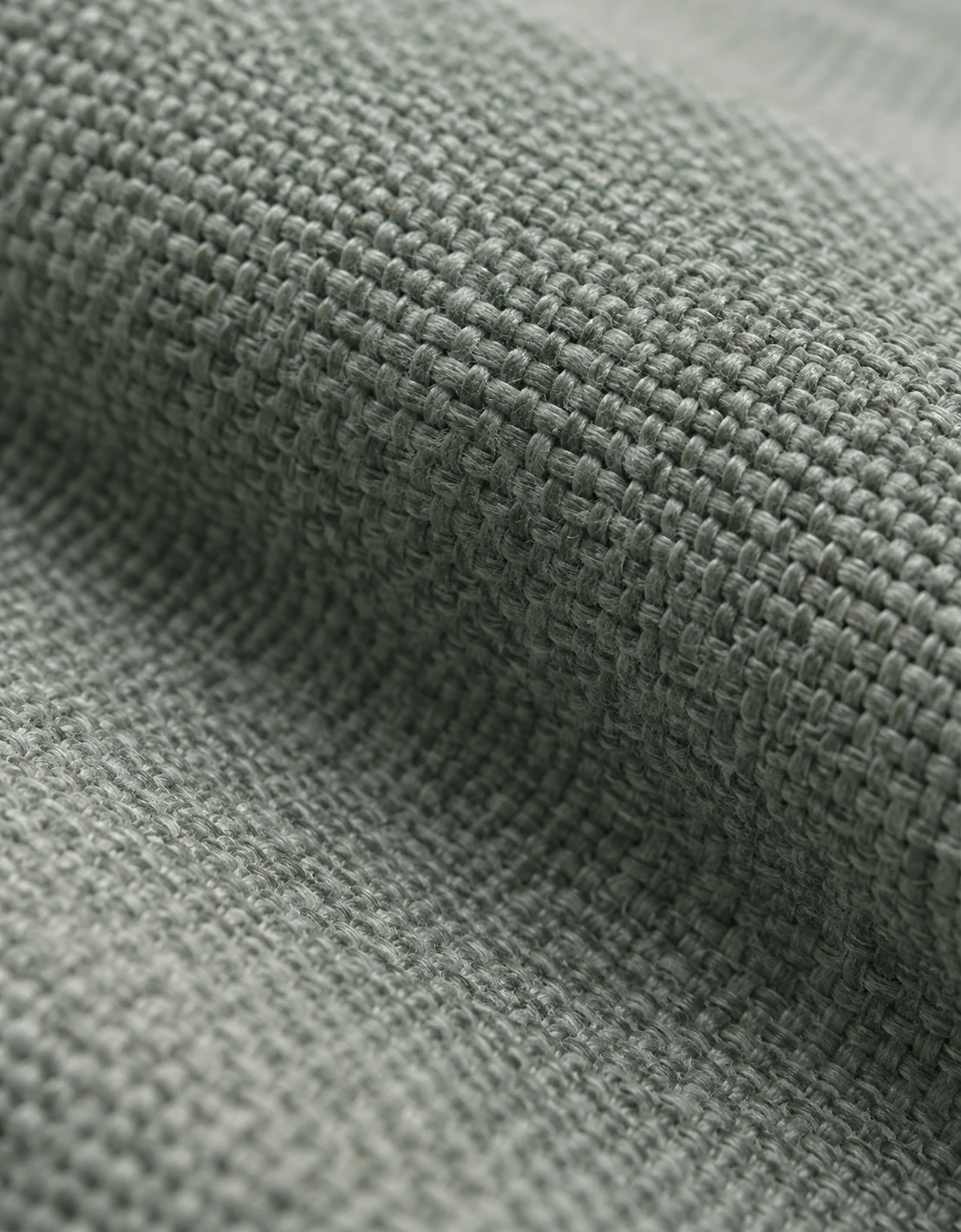 Sage green performance fabric with an open outdoor weave