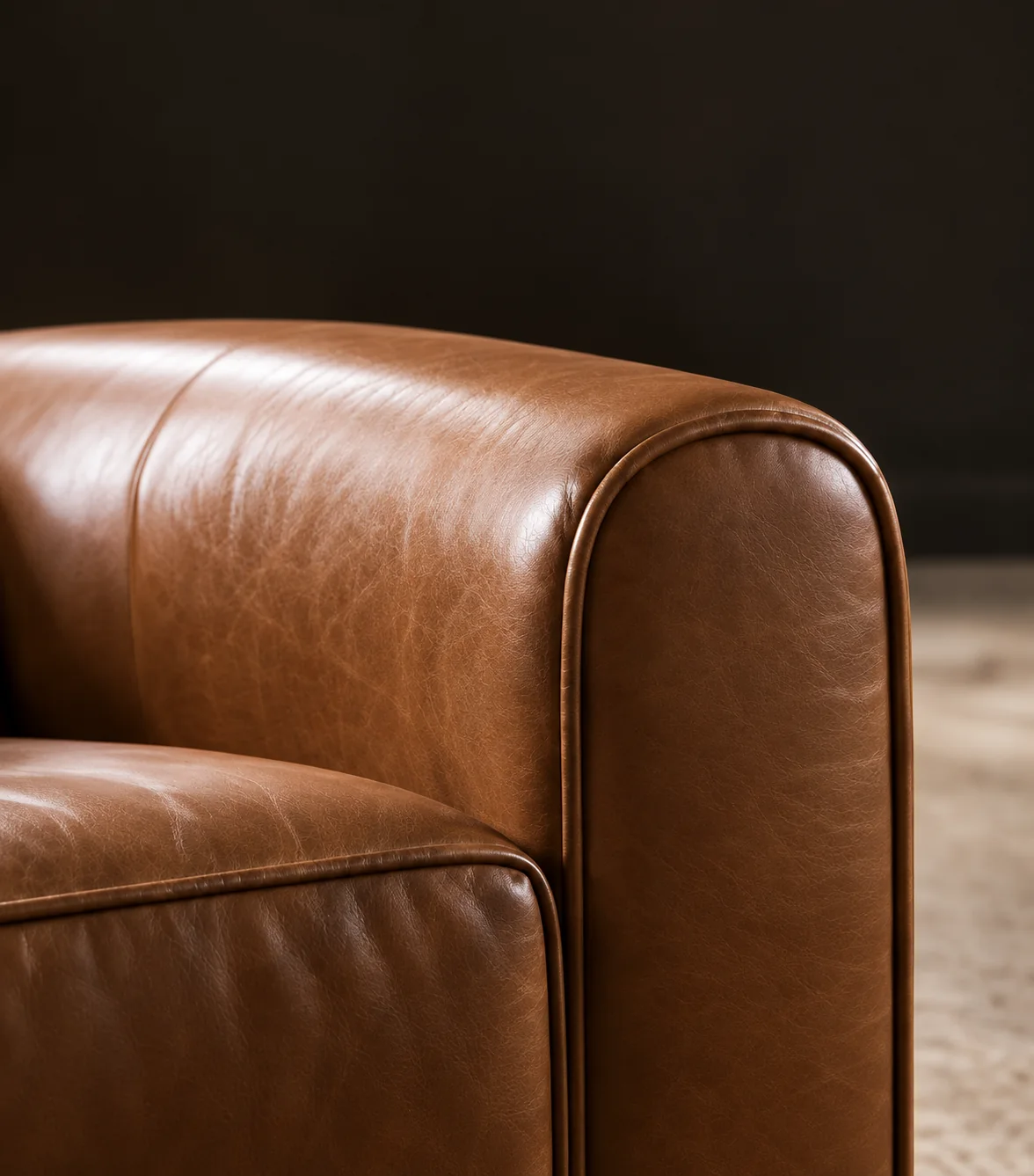 Cognac leather club chair with a rolled back