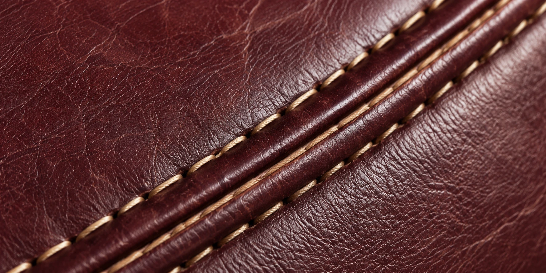 Double-stitched seam and piping on oxblood leather