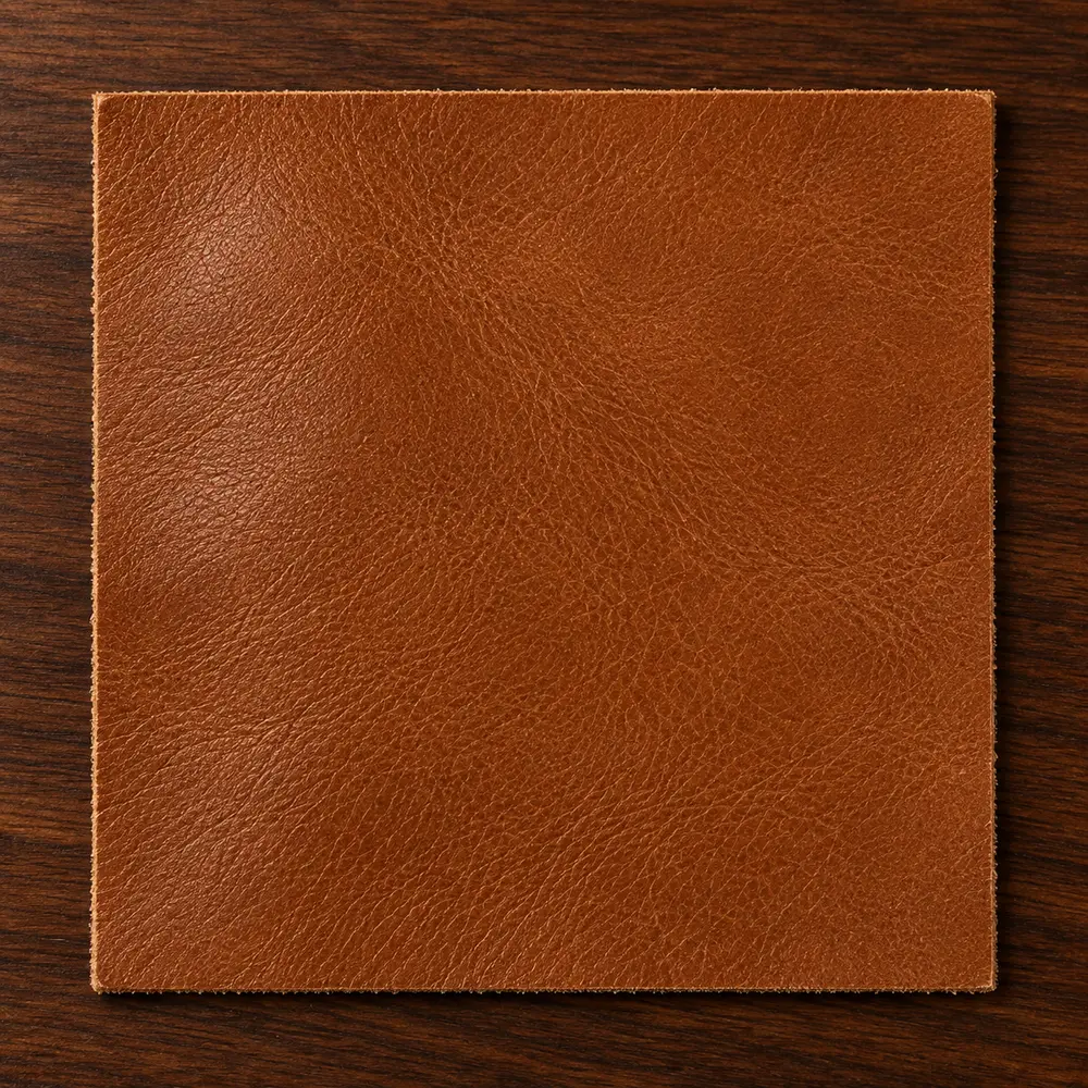 A brown commercial leather swatch from the program specification