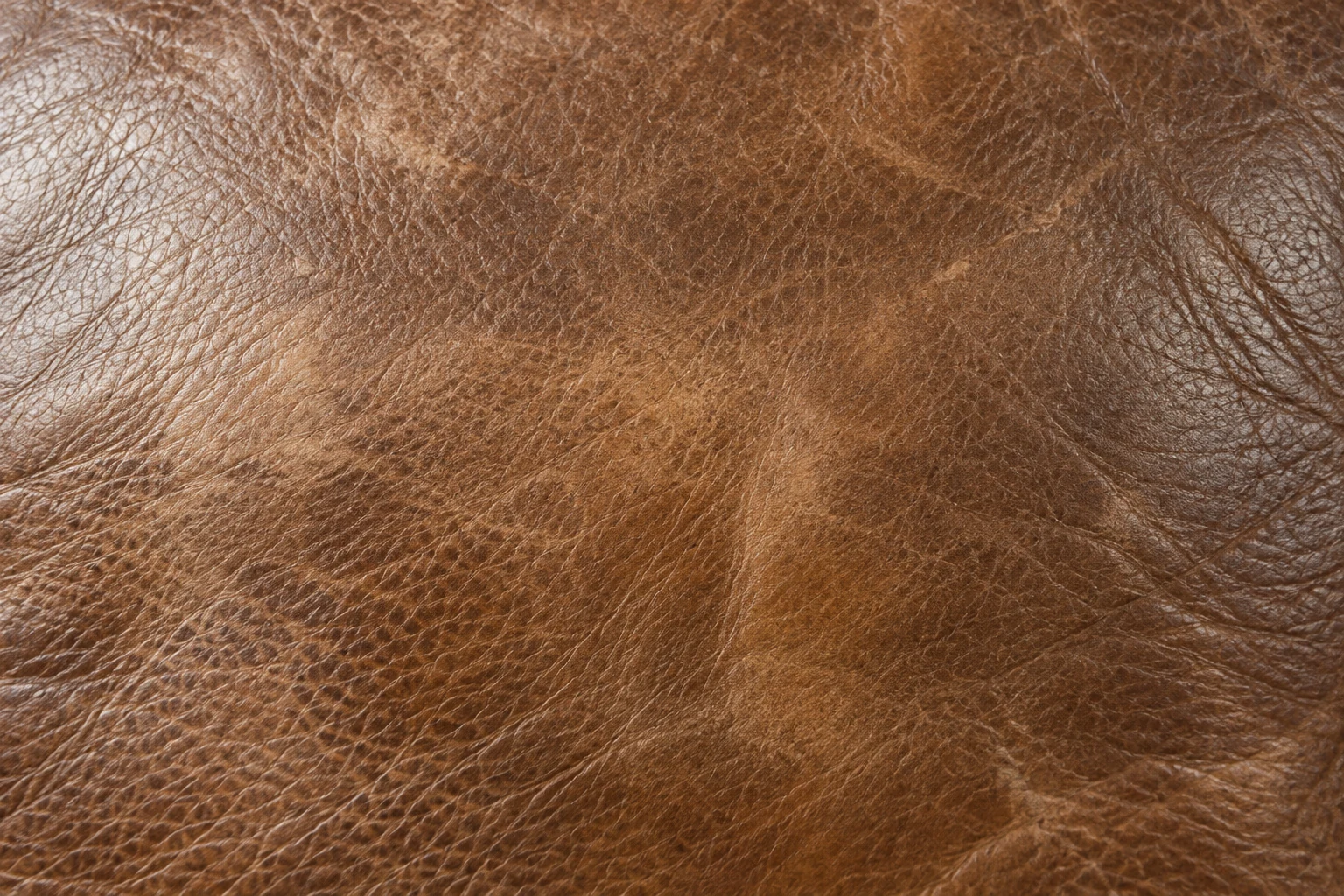 Faded and mottled leather on a recliner panel