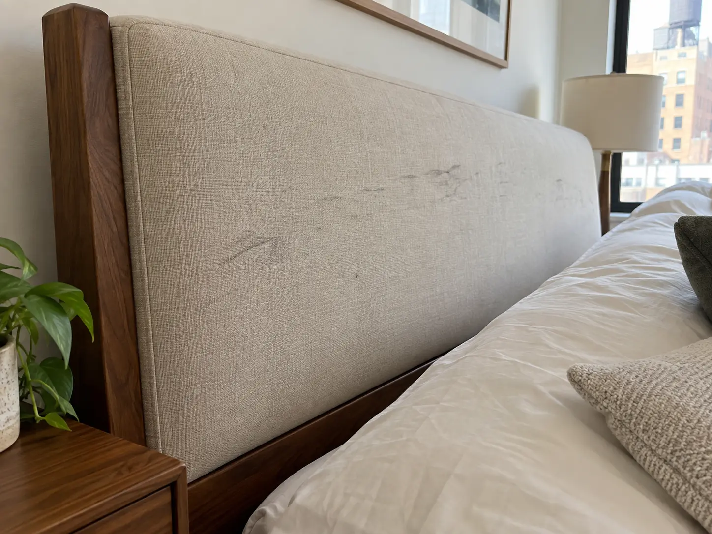 Scuffed linen headboard, before