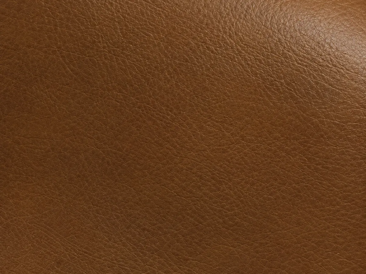 Smooth tan upholstery leather with an even, unbroken face and no printed grain