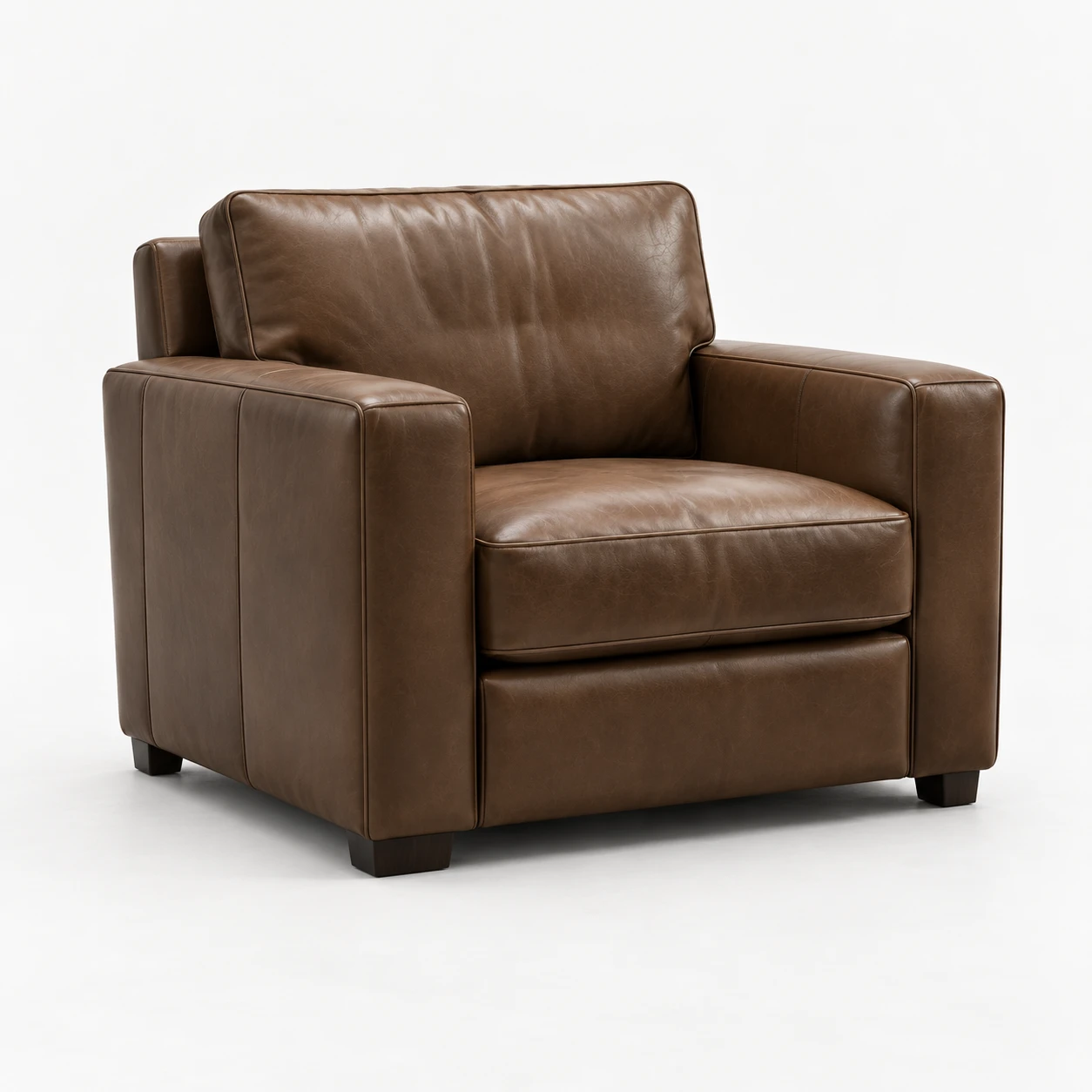 Wide brown leather armchair with a loose back cushion and block feet