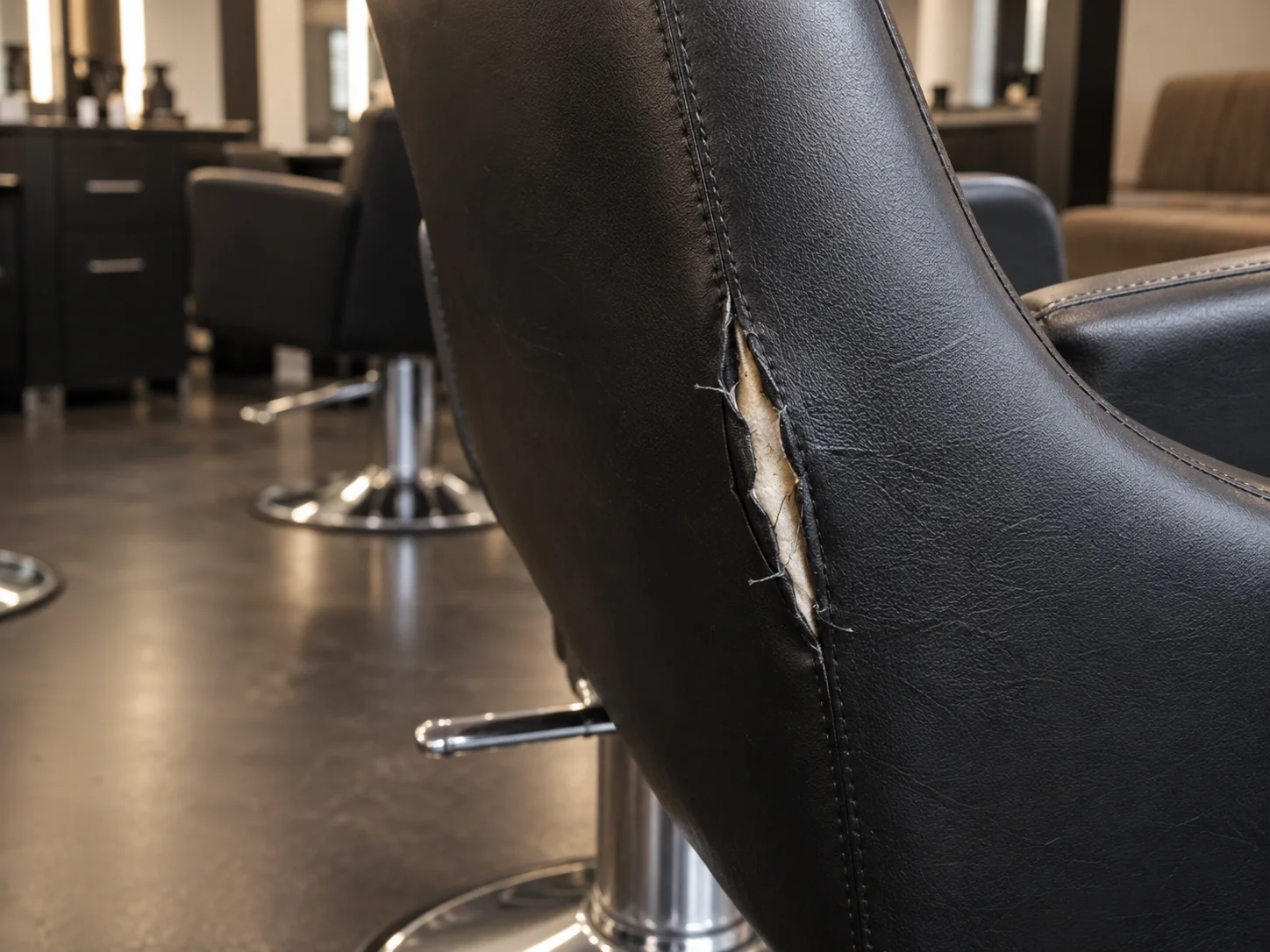 A split seam on a salon chair backrest