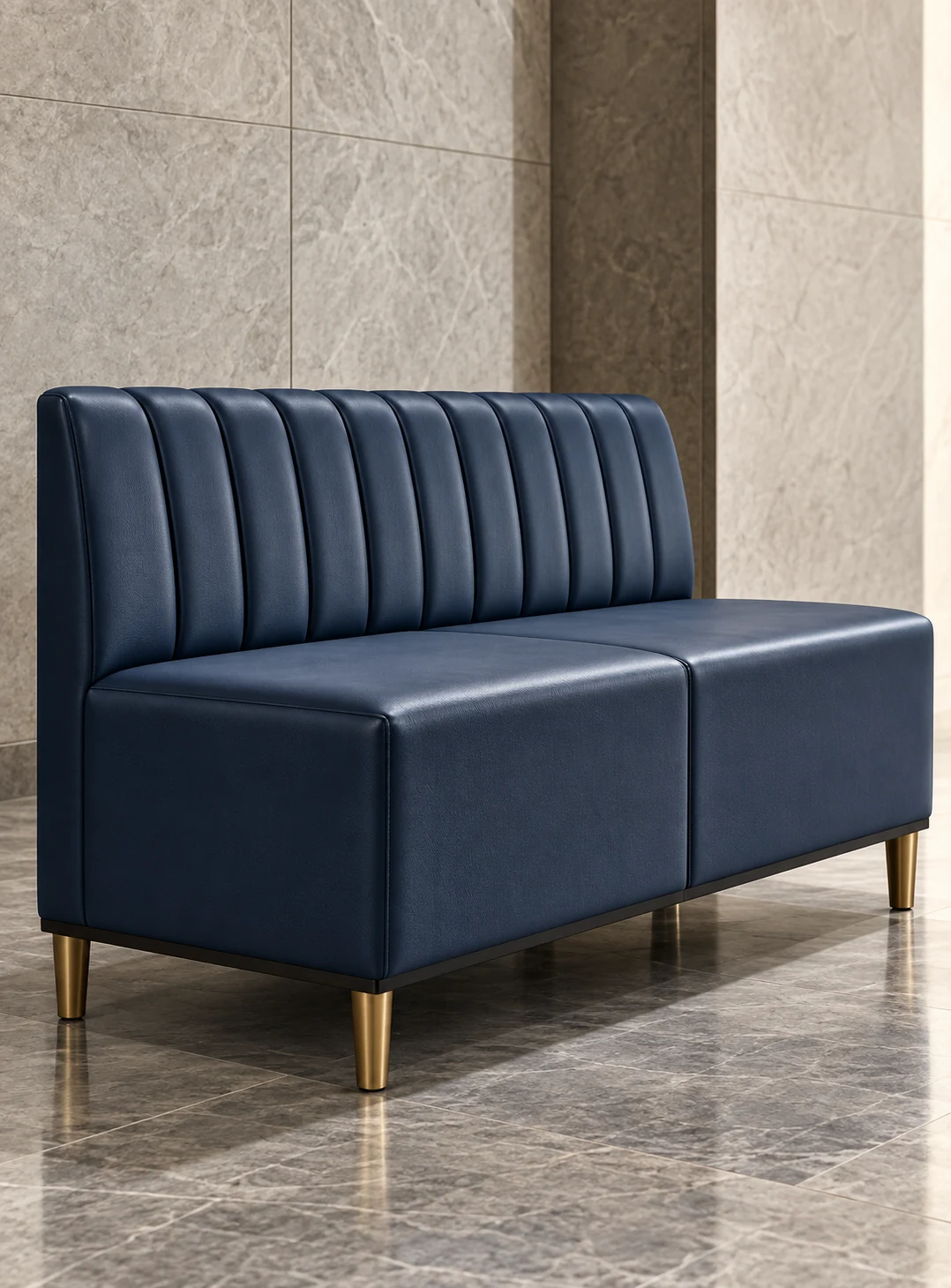Channel tufted reception bench in navy upholstery on slim brass legs