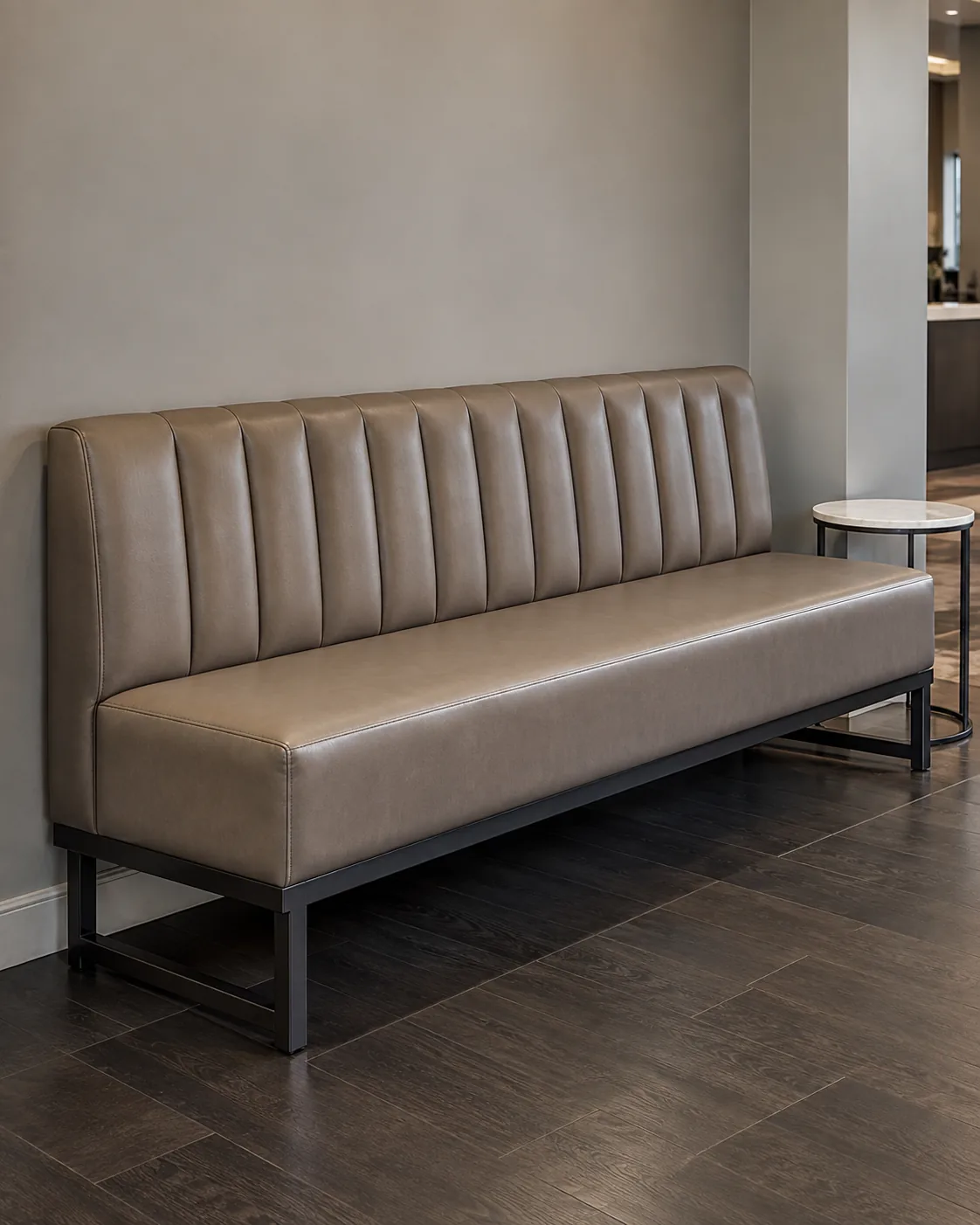 A tufted waiting bench in a salon reception
