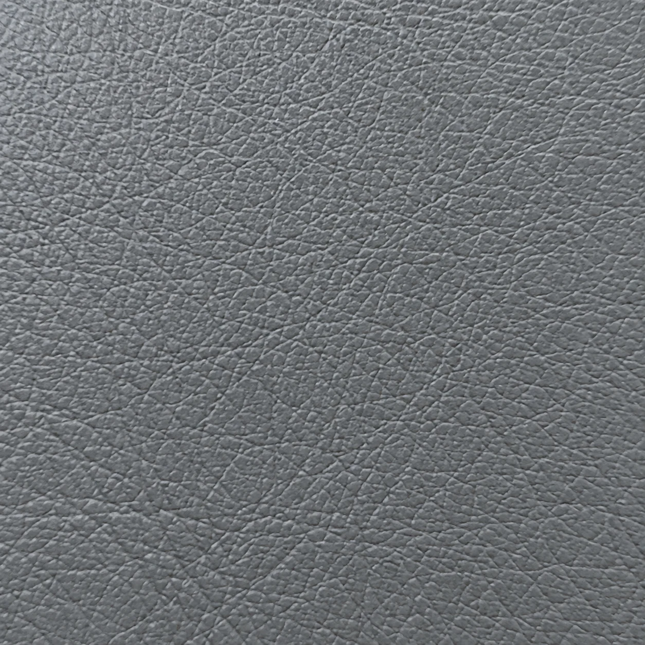 Macro of gray school bus seat vinyl grain