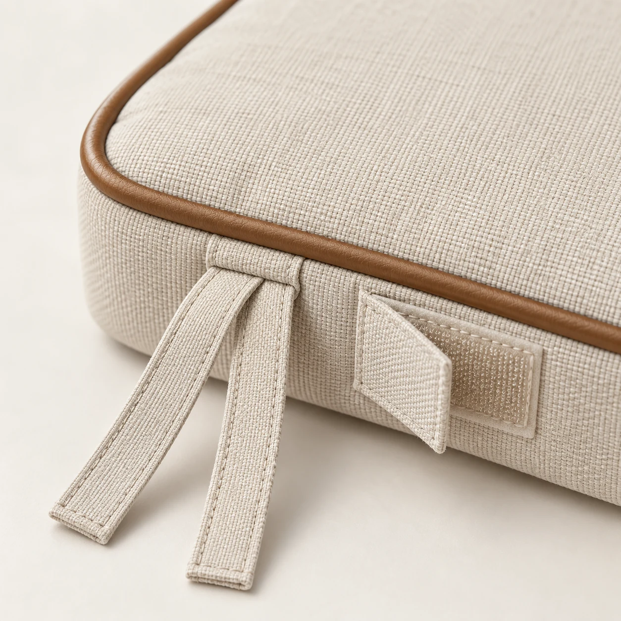 Seat pad ties and hook-and-loop straps holding a pad to the frame