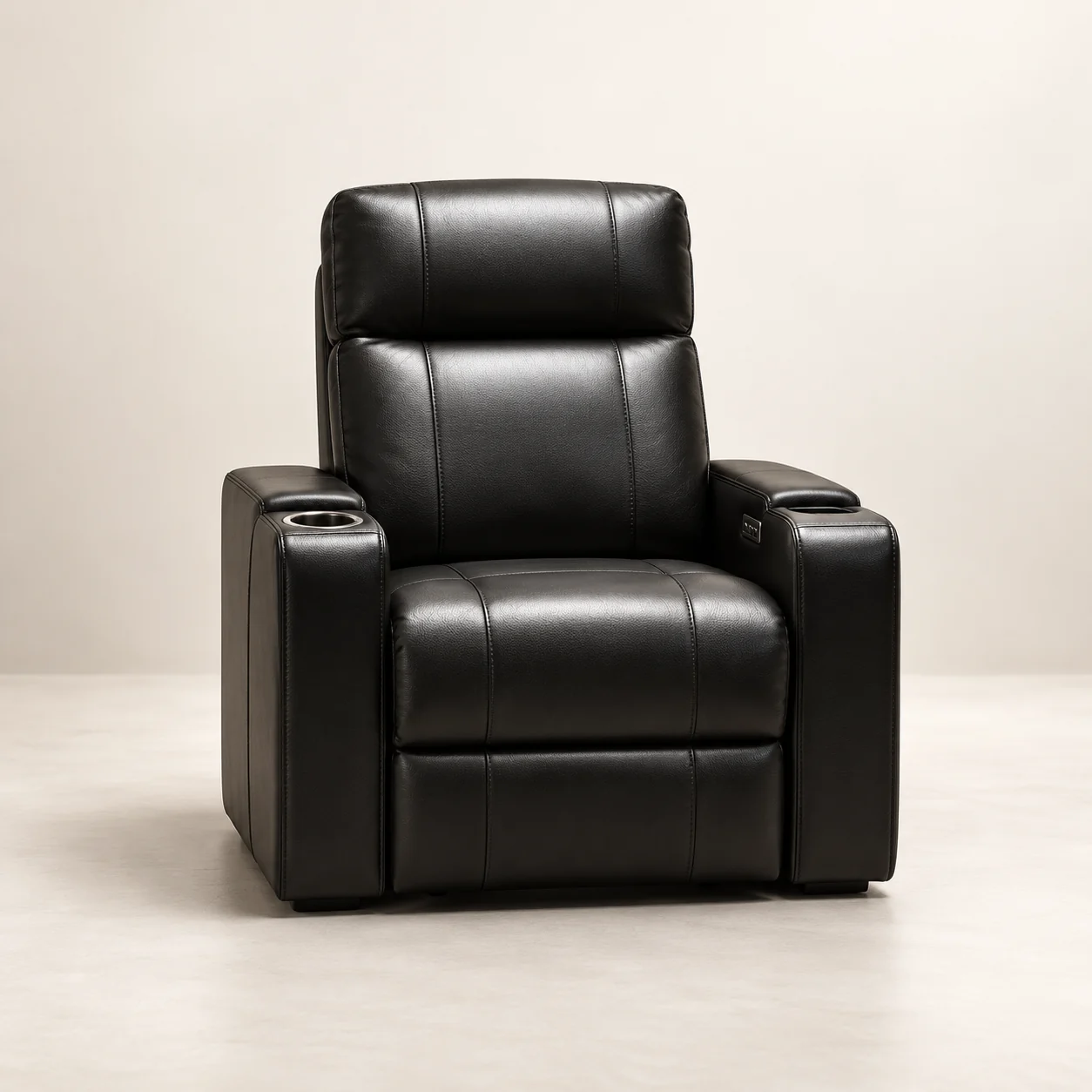 Single black leather home theater recliner with a console cupholder in each arm