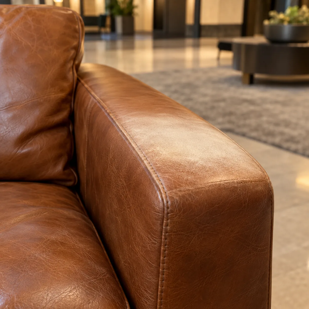 A sun-faded arm on lounge seating