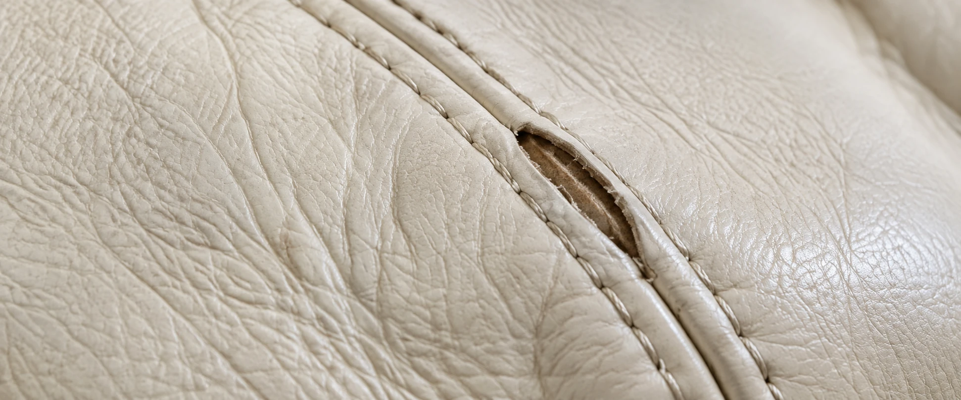 Split seam on a cream Togo leather cover