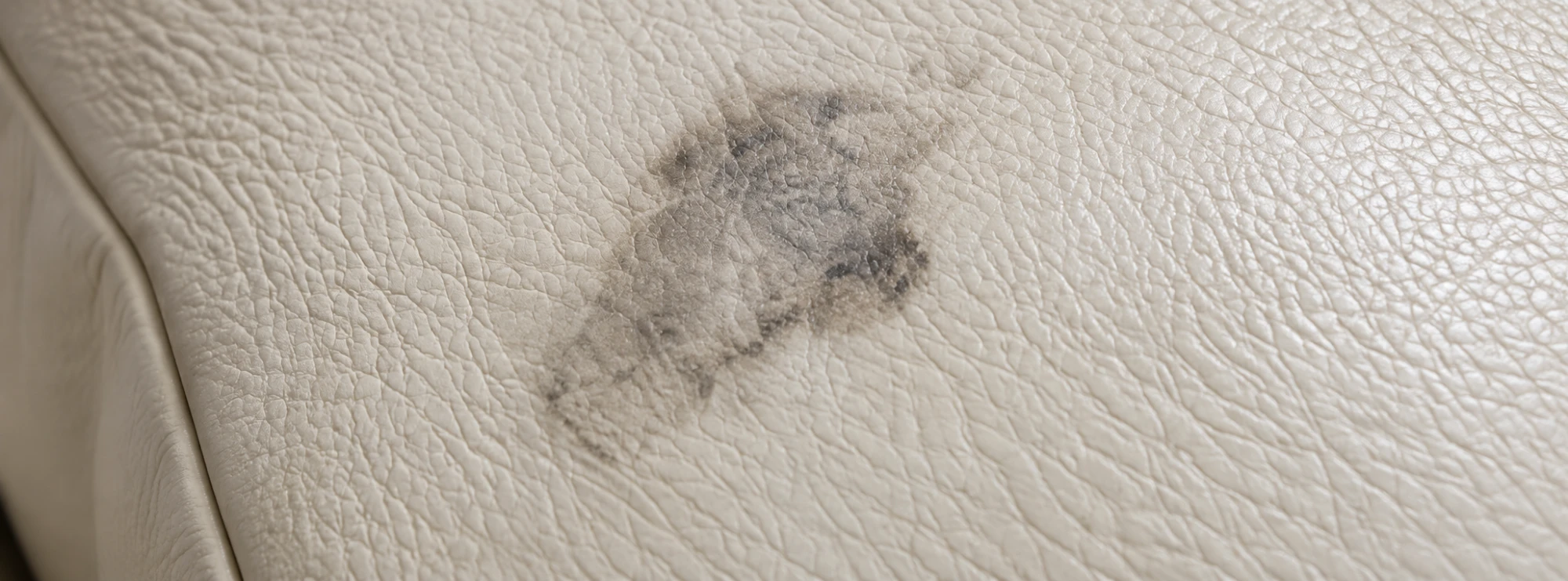 Stains and marks on cream Togo leather