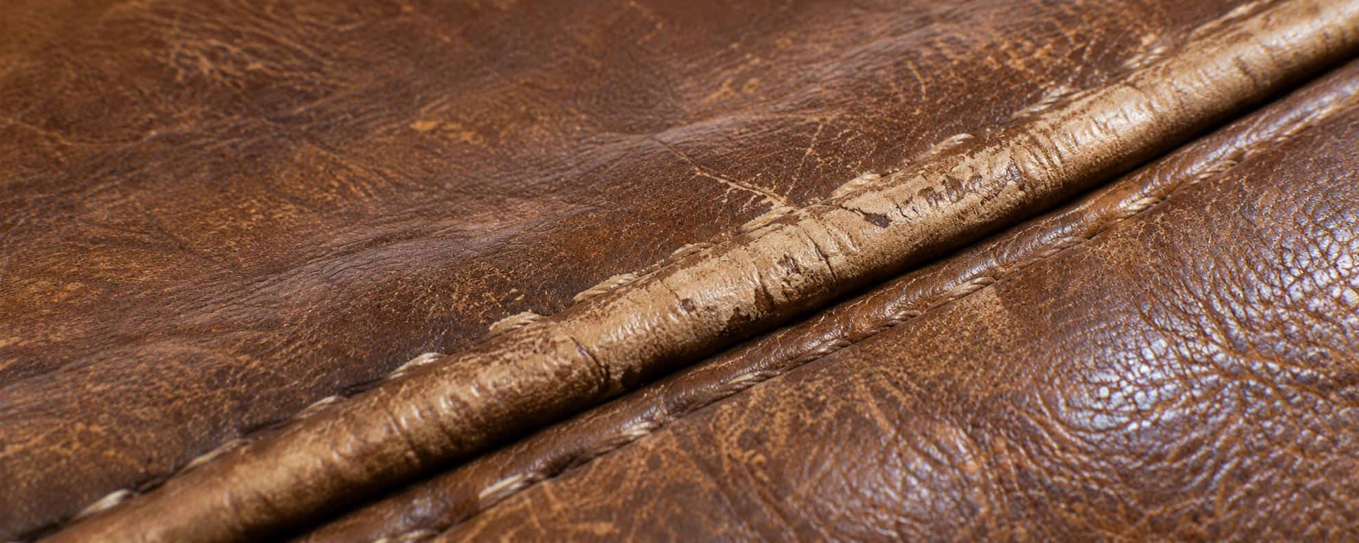 Worn welt edge on brown Togo leather