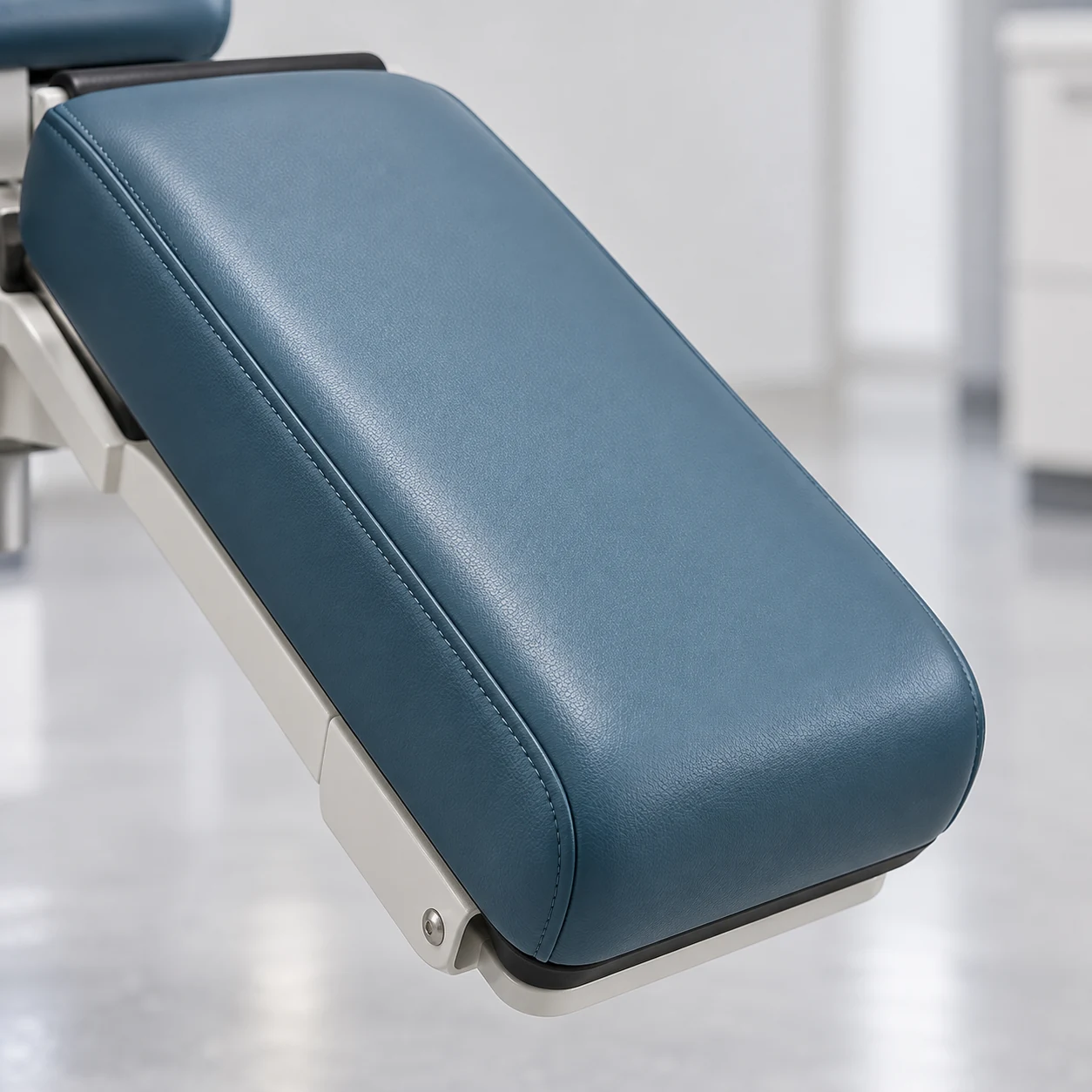 Treatment chair pad mounted on its own painted steel bracket
