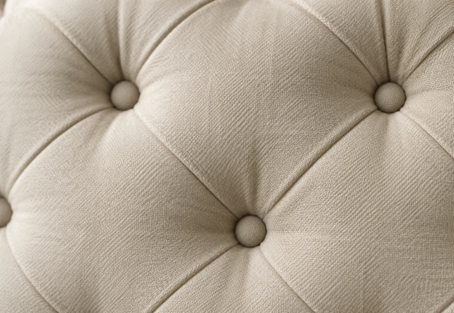 Button tufting on cream upholstery