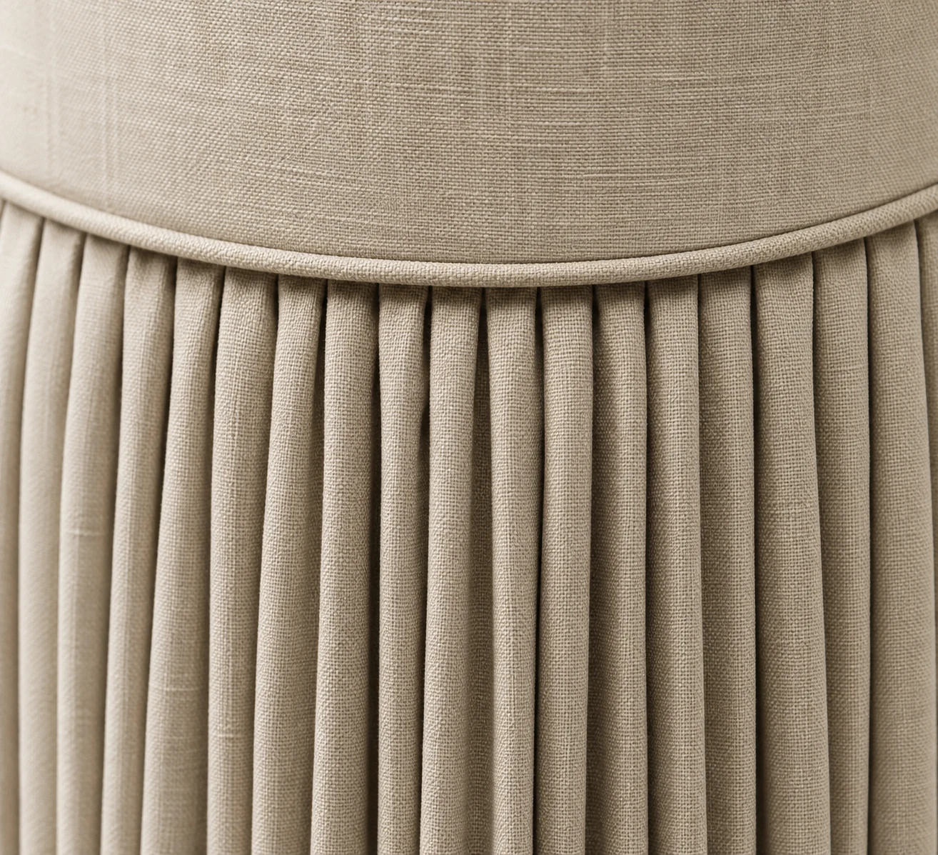 Knife-pleated upholstered skirt in cream linen