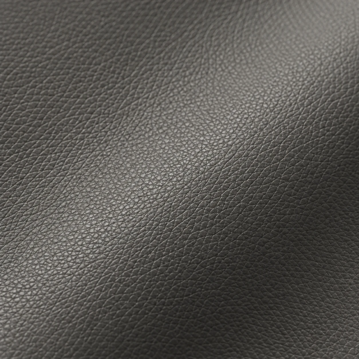 Pigmented leather swatch in charcoal with an even finish