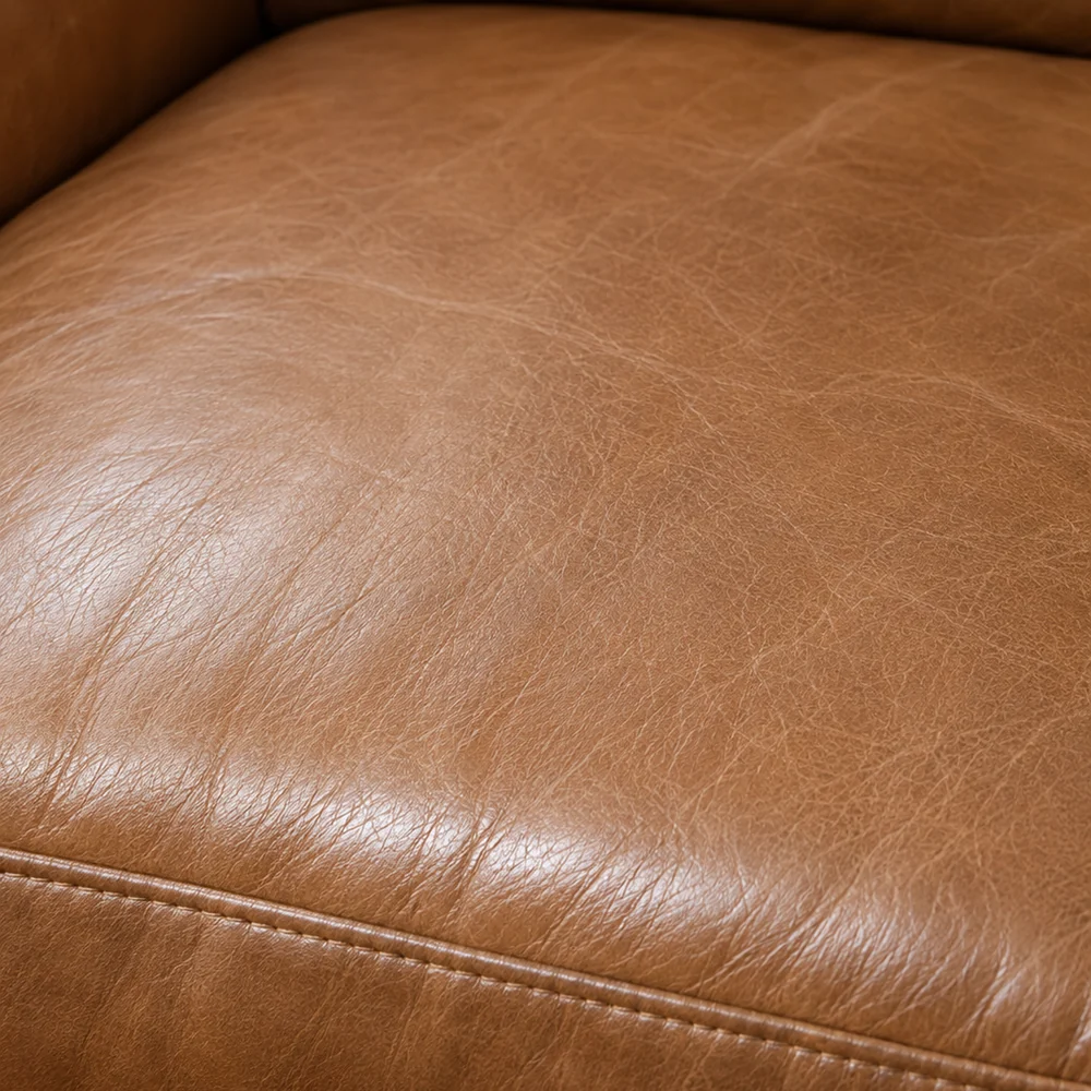 The same seat cushion after repair, with no mark and one even tan colour across the panel