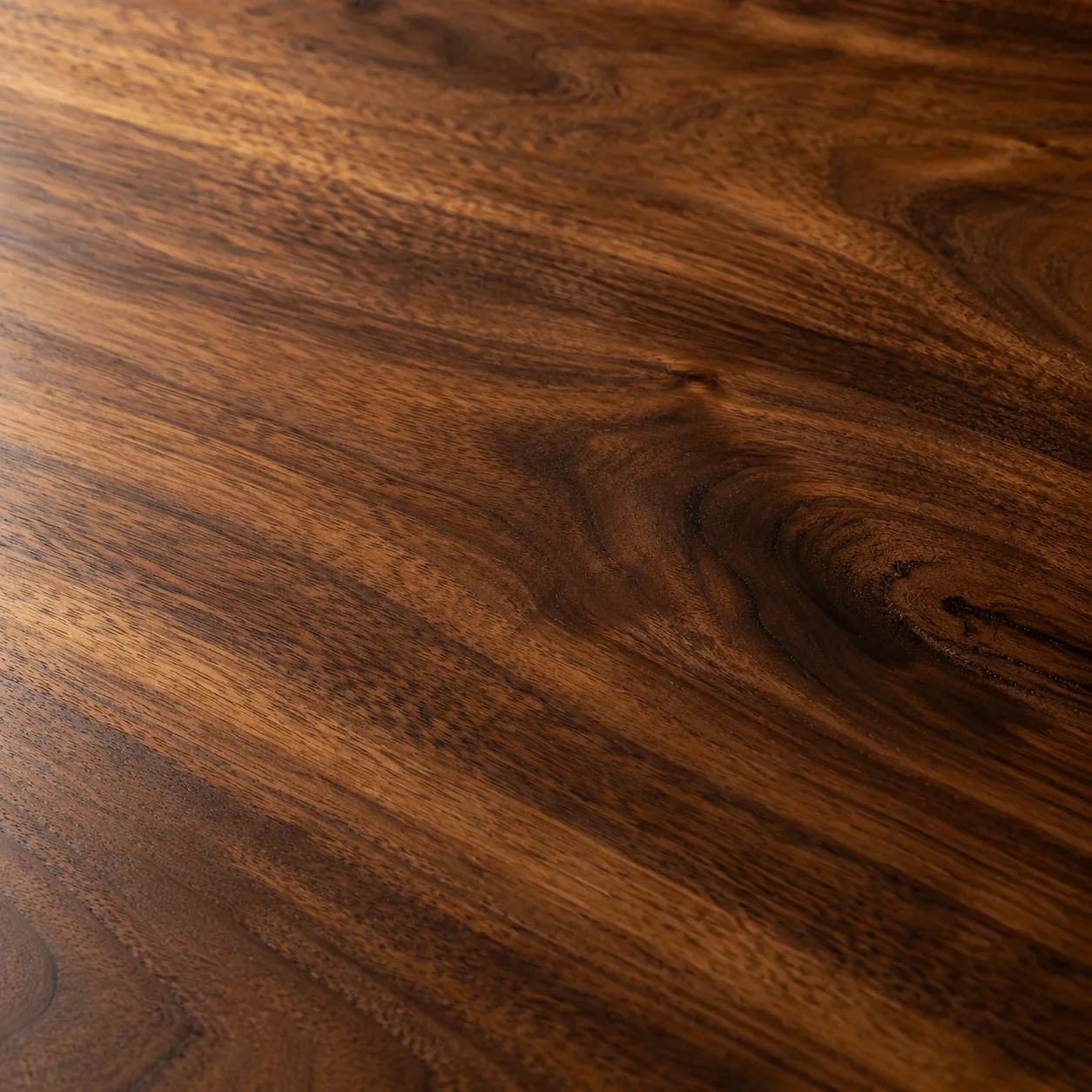 Wood being refinished on a table surface