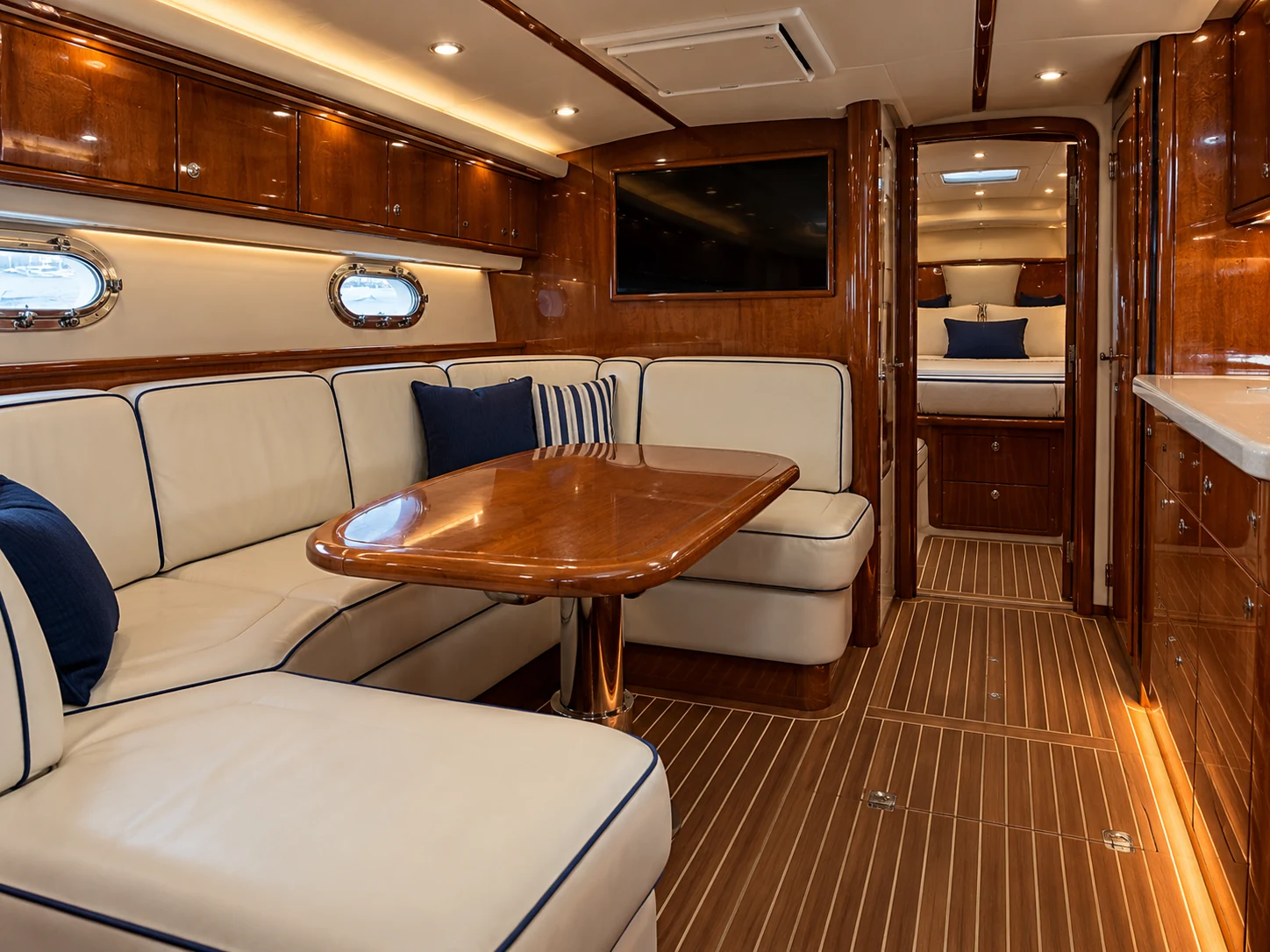 Cream leather settee seating in a yacht saloon
