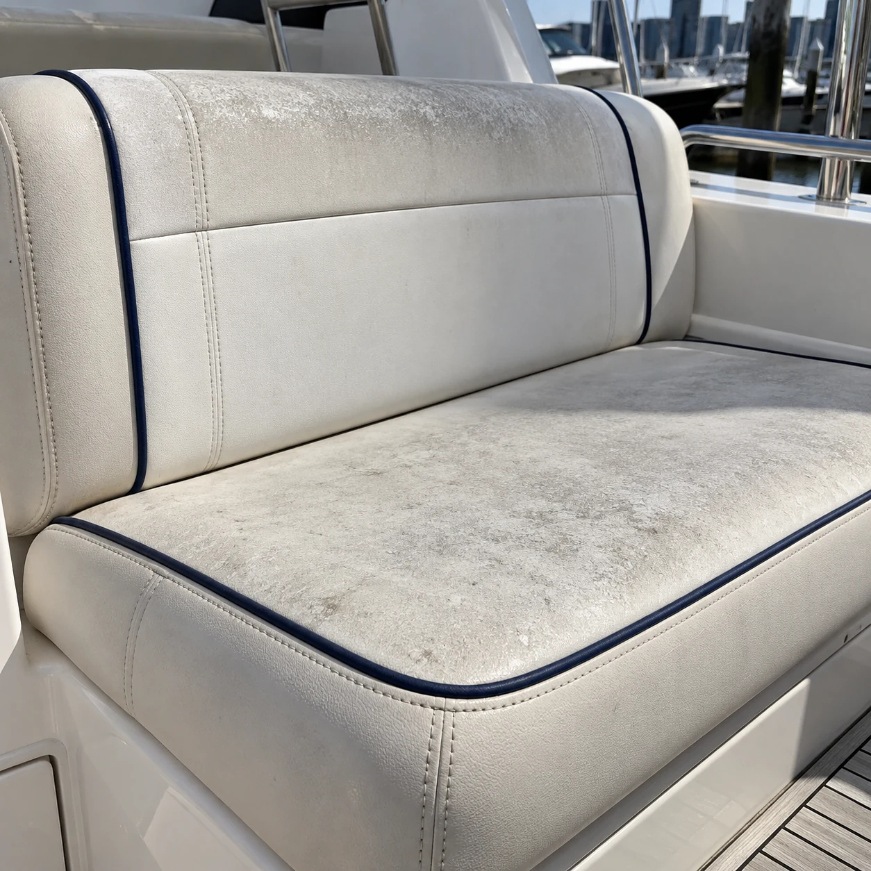 A chalky white yacht seat in sunlight